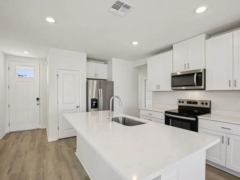 Furnished interior view inside a new home in The Grove at Stuart Crossing - Premier Series, Bartow (Image 4).