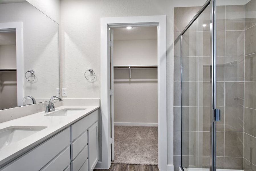 A bathroom with a glass shower.