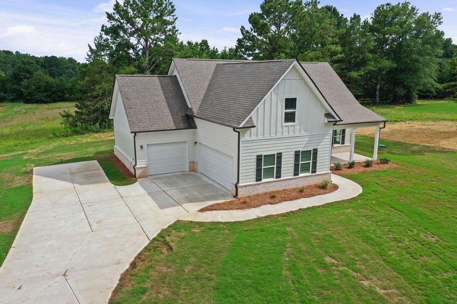 Front exterior of a new home in , McDonough, GA, highlighting curb appeal (Image 14). Front exterior of a new home in , McDonough, GA, highlighting curb appeal (Image 14).