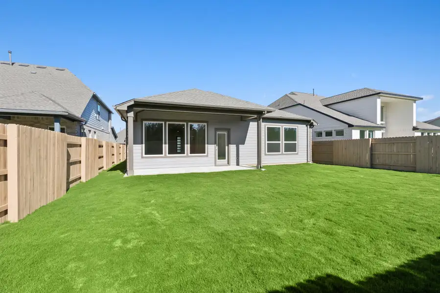 Exterior details and patio area of a home in The Colony, Bastrop (Image 3).