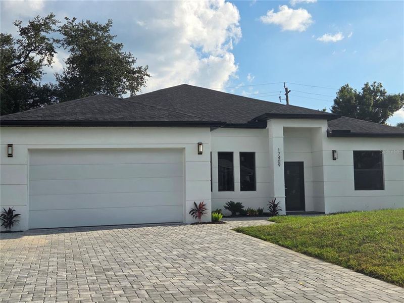 Front exterior of a new home in , Port Charlotte, FL, highlighting curb appeal (Image 14).