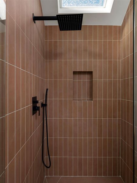 Bathroom featuring tiled shower