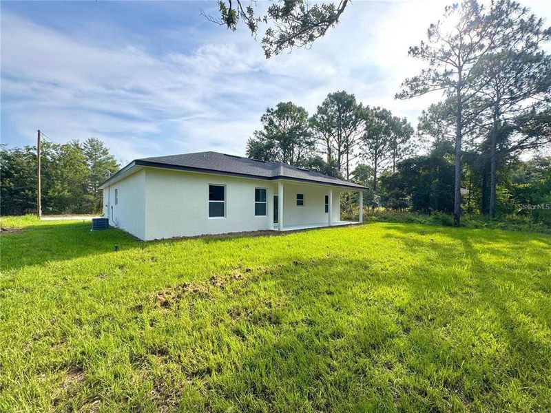 Exterior details and patio area of a home in , Citrus Springs (Image 16).
