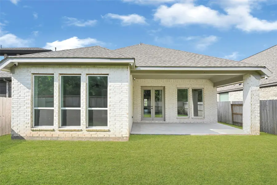 Front exterior of a new home in Grand Central Park 45', Conroe, TX, highlighting curb appeal (Image 2). Front exterior of a new home in Grand Central Park 45', Conroe, TX, highlighting curb appeal (Image 2).