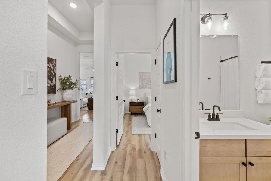 Hallway connecting front bedrooms and bathroom to home