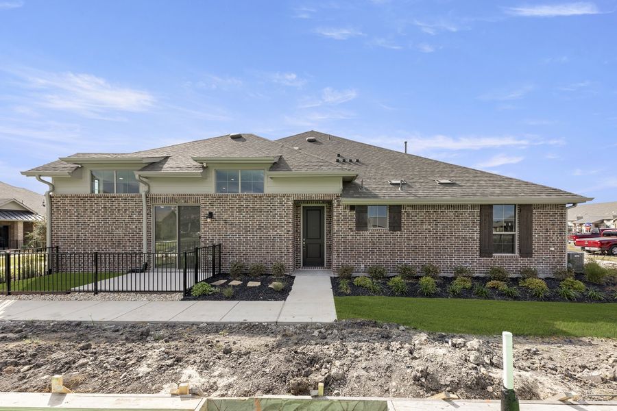 Front exterior of a new home in Woodbridge Villas, Wylie, TX, highlighting curb appeal (Image 19). Front exterior of a new home in Woodbridge Villas, Wylie, TX, highlighting curb appeal (Image 19).