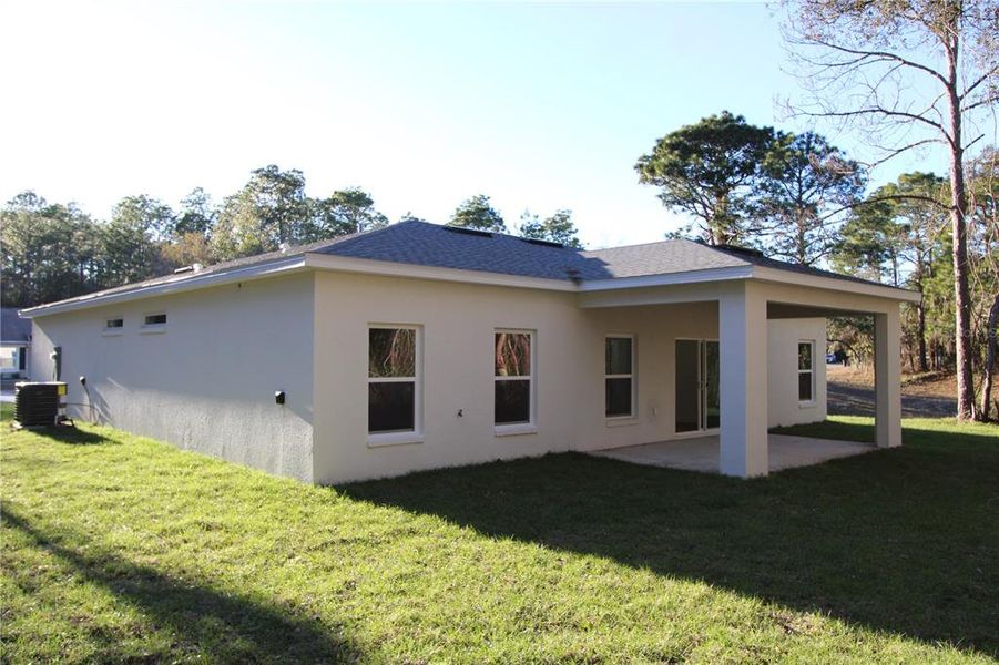 Exterior details and patio area of a home in , Citrus Springs (Image 20).