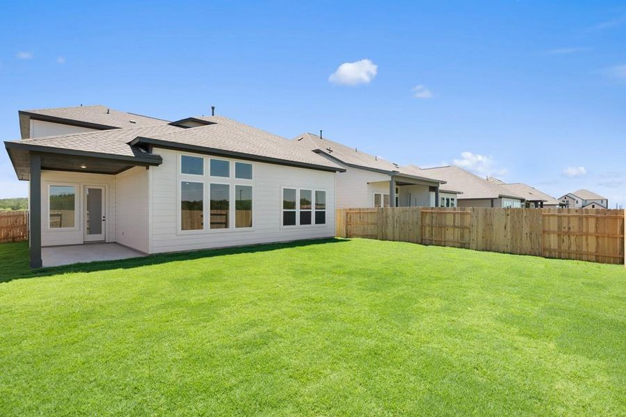 Front exterior of a new home in Lagos Reserve, Manor, TX, highlighting curb appeal (Image 2). Front exterior of a new home in Lagos Reserve, Manor, TX, highlighting curb appeal (Image 2).