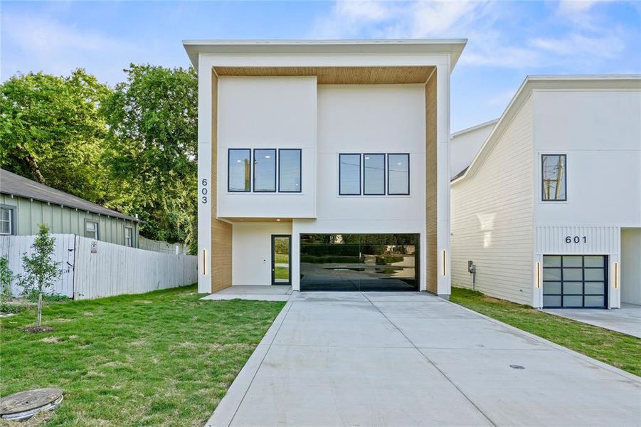 Contemporary home with driveway and stucco siding Contemporary home with driveway and stucco siding