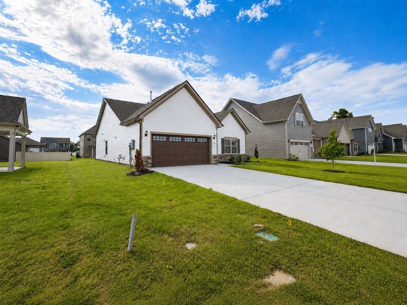Front exterior of a new home in Salem Landing, Rockvale, TN, highlighting curb appeal (Image 14). Front exterior of a new home in Salem Landing, Rockvale, TN, highlighting curb appeal (Image 14).