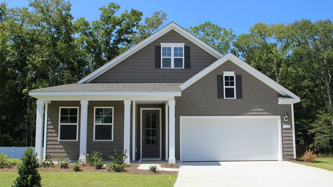 Front exterior of a new home in The Retreat at Wild Wing, Conway, SC, highlighting curb appeal (Image 1).