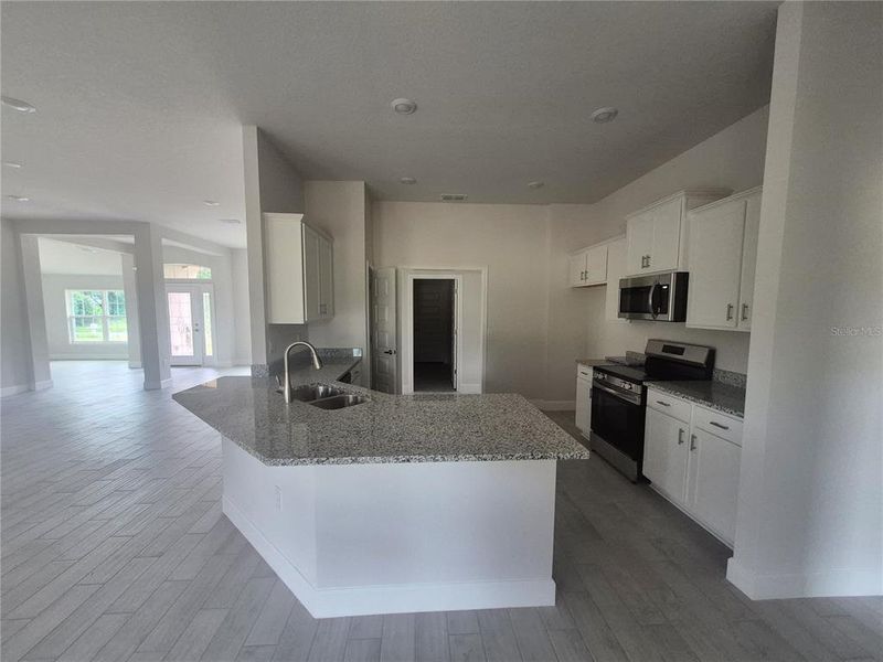 Furnished interior view inside a new home in Hill Country Estates, Dade City (Image 15).
