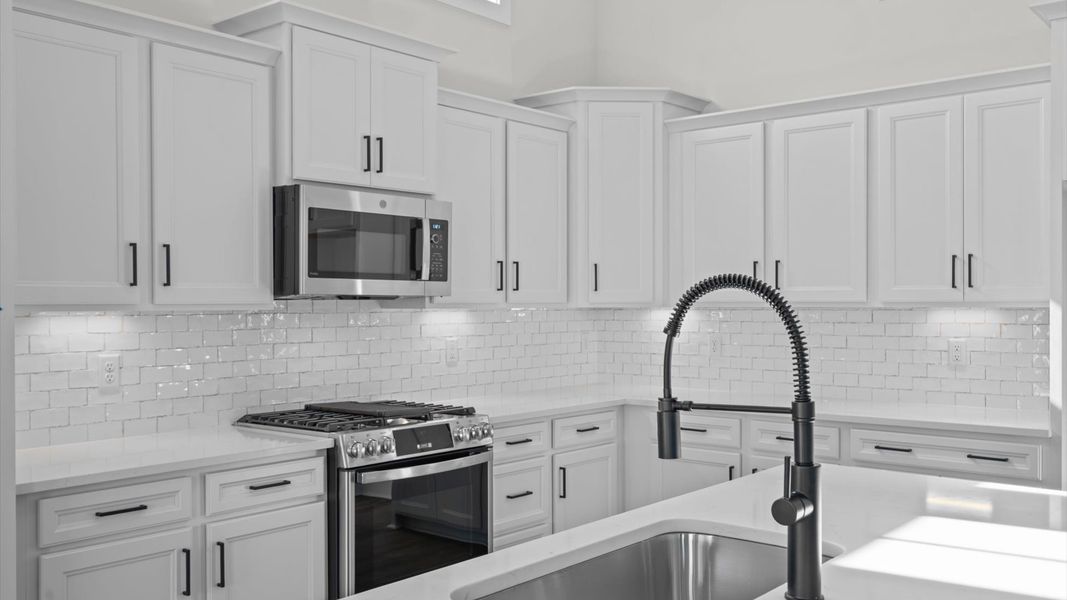 Accomplished design in a kitchen that blends function and form with a right-sized island