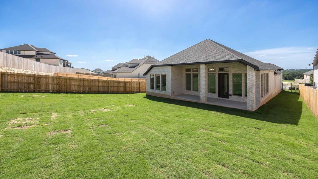Exterior details and patio area of a home in Santa Rita Ranch - Eldorado, Liberty Hill (Image 3).