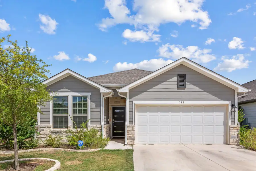 Front exterior of a new home in The Ridge at Trinity Ranch, Elgin, TX, highlighting curb appeal (Image 2). Front exterior of a new home in The Ridge at Trinity Ranch, Elgin, TX, highlighting curb appeal (Image 2).