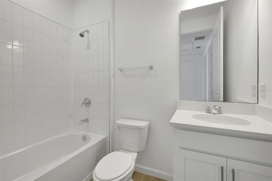 Furnished interior view inside a new home in Serenade at Ovation, Winter Garden (Image 17).