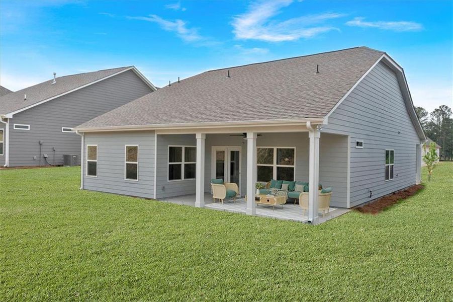 Exterior details and patio area of a home in Heritage Pointe at The Georgian, Villa Rica (Image 4).