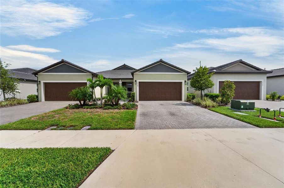 Front exterior of a new home in , Parrish, FL, highlighting curb appeal (Image 27).