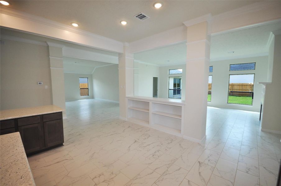 Breakfast Area of the kitchen with built in shelves and buffet tops