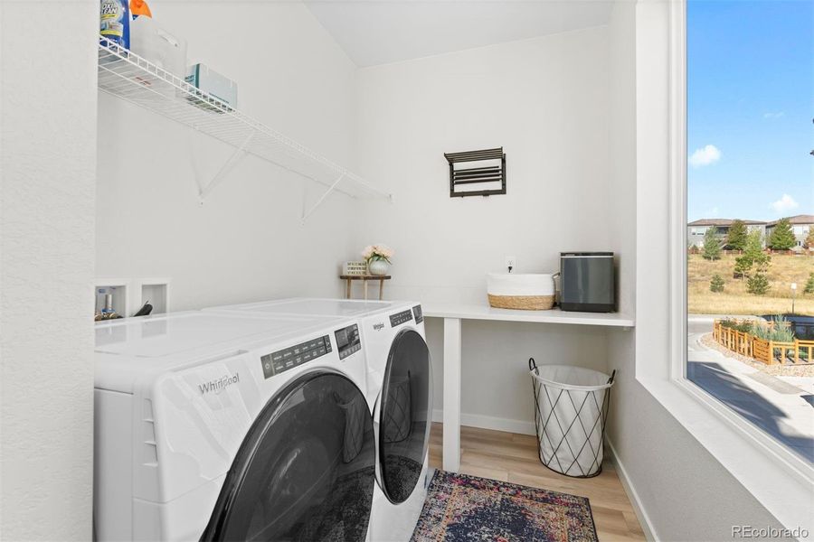 Large laundry room with special touches for storage and convenience