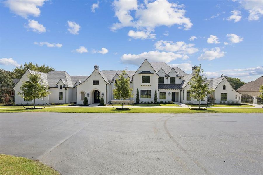 Front exterior of a new home in , Westlake, TX, highlighting curb appeal (Image 24). Front exterior of a new home in , Westlake, TX, highlighting curb appeal (Image 24).