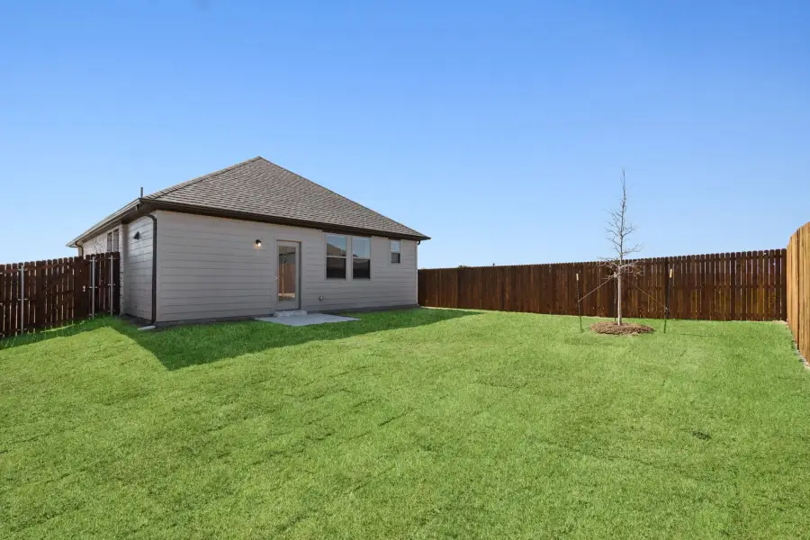 Back Yard in the Ash home plan by Trophy Signature Homes – REPRESENTATIVE PHOTO Back Yard in the Ash home plan by Trophy Signature Homes – REPRESENTATIVE PHOTO