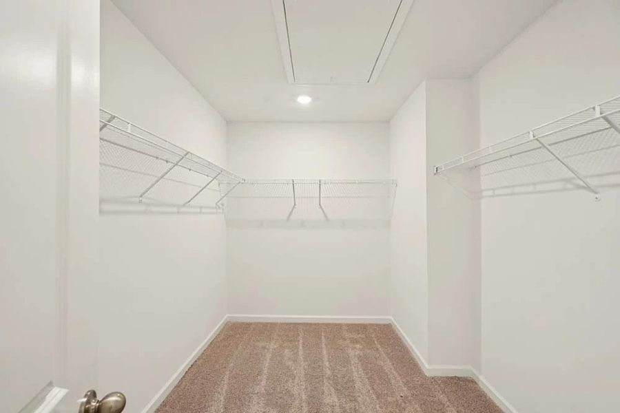 Sample Photo: Primary Bedroom Walk-In Closet Sample Photo: Primary Bedroom Walk-In Closet