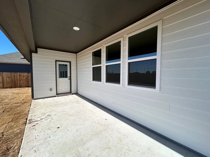 Exterior details and patio area of a home in Willow Springs, Buda (Image 16).