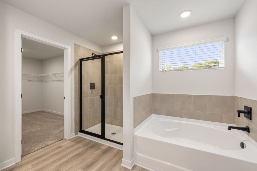 A bathroom with a glass shower.