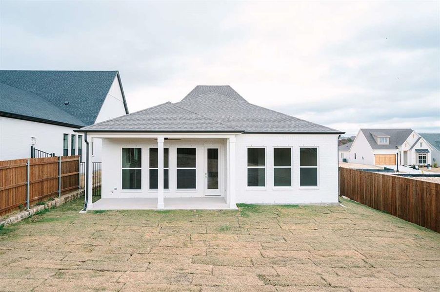 Rear view of house featuring a patio