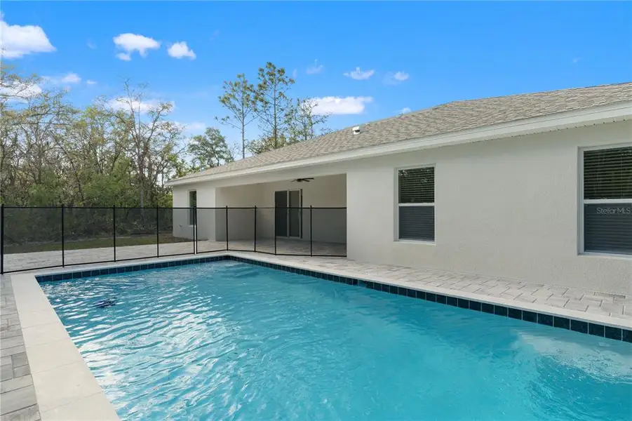 Exterior details and patio area of a home in , Weeki Wachee (Image 31).