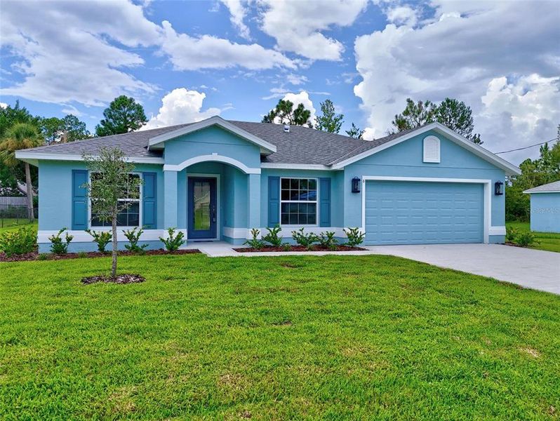 Front exterior of a new home in , Palm Coast, FL, highlighting curb appeal (Image 24).