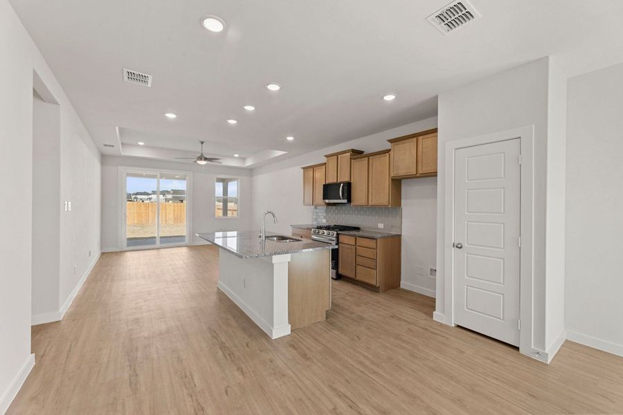 Representative furnished interior of a home built from the Clovis by Hakes Brothers in Hunters Ranch, San Antonio (Image 5).