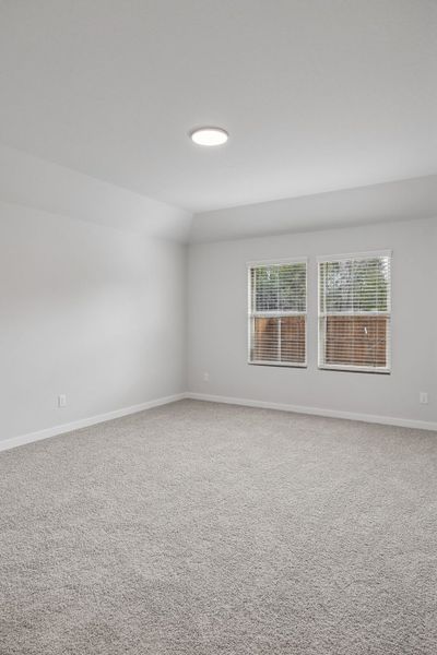 Primary Suite in the Heisman home plan by Trophy Signature Homes – REPRESENTATIVE PHOTO