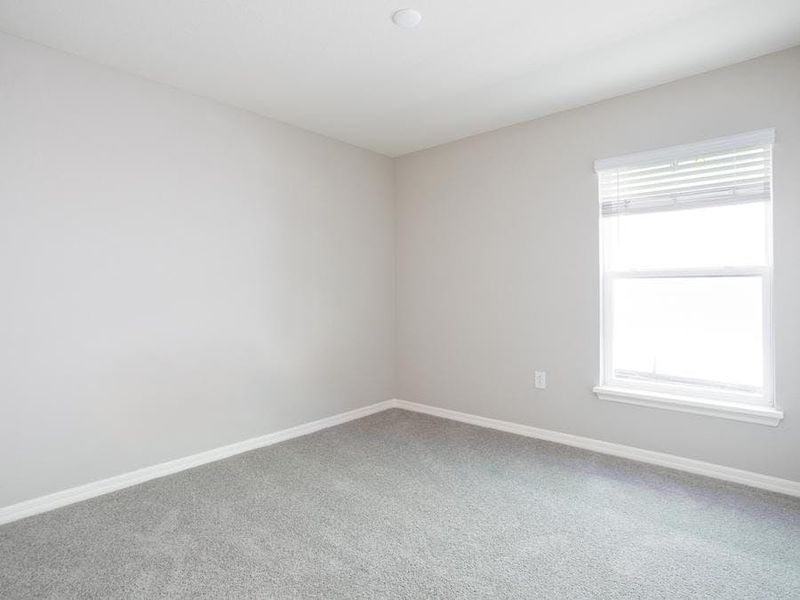 Relax in the third bedroom with your very own closet. Photo showcases a home with similar finishes. Color and design options in actual home for sale may differ.