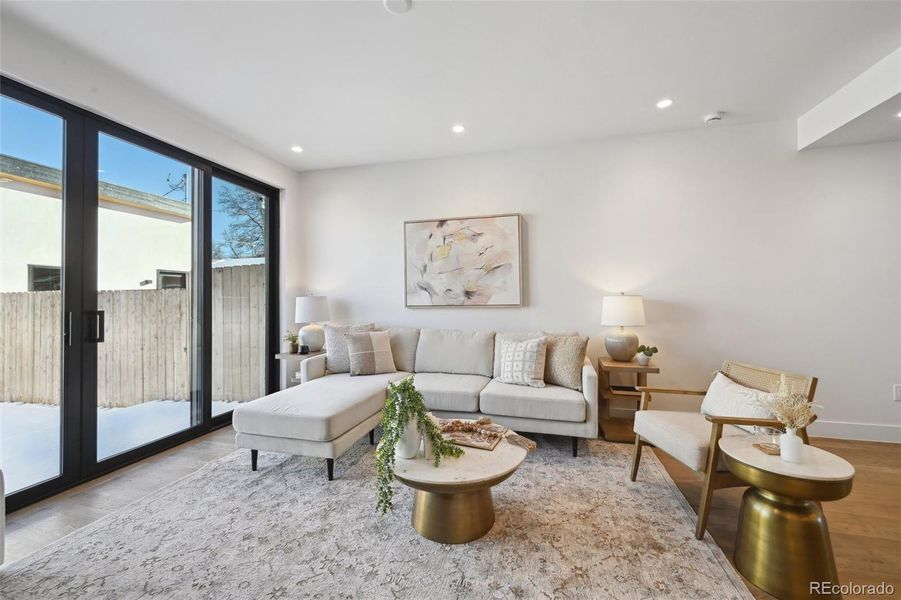 Family room with fireplace, opening onto backyard