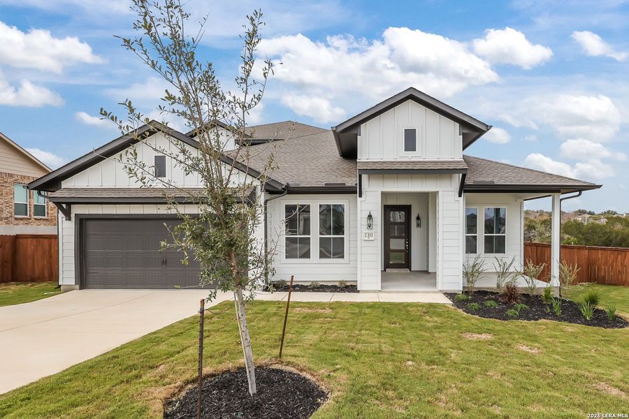 Front exterior of a new home in Homestead, Schertz, TX, highlighting curb appeal (Image 21). Front exterior of a new home in Homestead, Schertz, TX, highlighting curb appeal (Image 21).