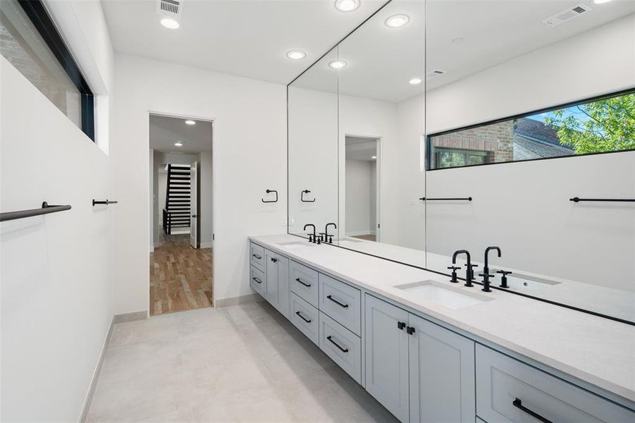 Bathroom with vanity and tile patterned floors