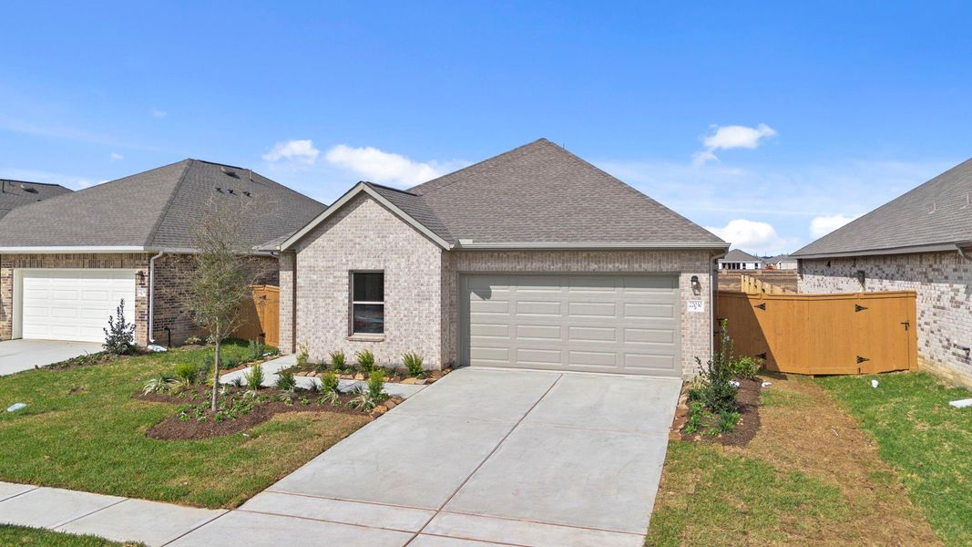 Front exterior of a new home in Cypress Green, Hockley, TX, highlighting curb appeal (Image 19).