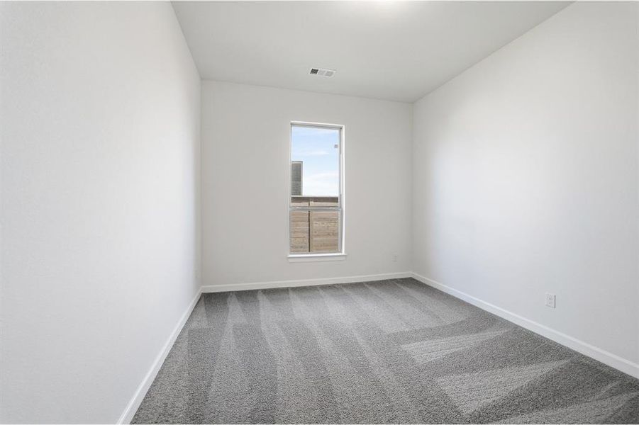Neutral wall tones with a single window providing natural light