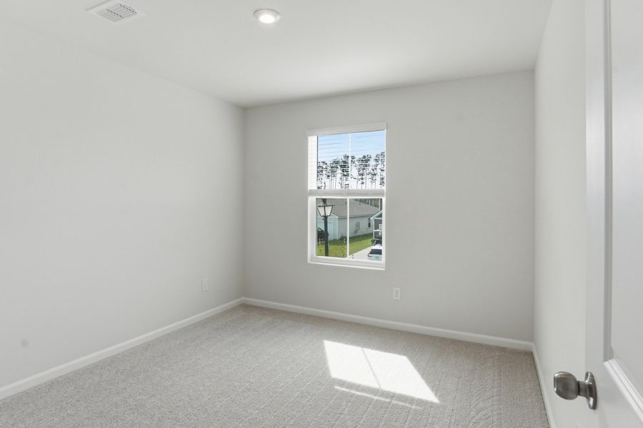 Spacious, unfurnished interior of a new home in Sanctuary Cove at Cane Bay, Summerville (Image 40).