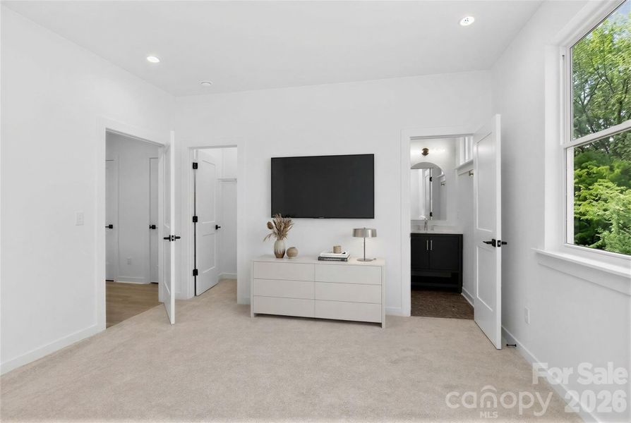 Upper level bedroom suite virtually staged.