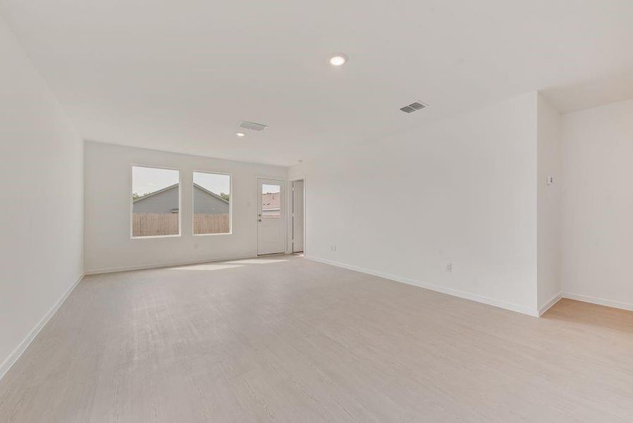 Unfurnished room with light wood finished floors and recessed lighting