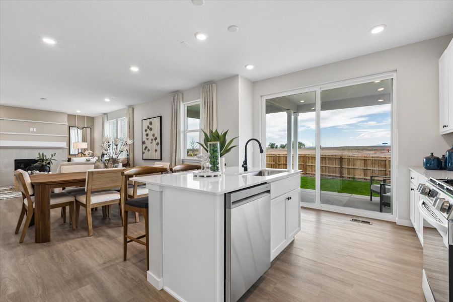A kitchen with a large window. A kitchen with a large window.