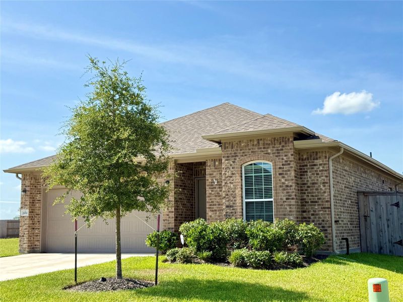 Front exterior of a new home in , Angleton, TX, highlighting curb appeal (Image 27).
