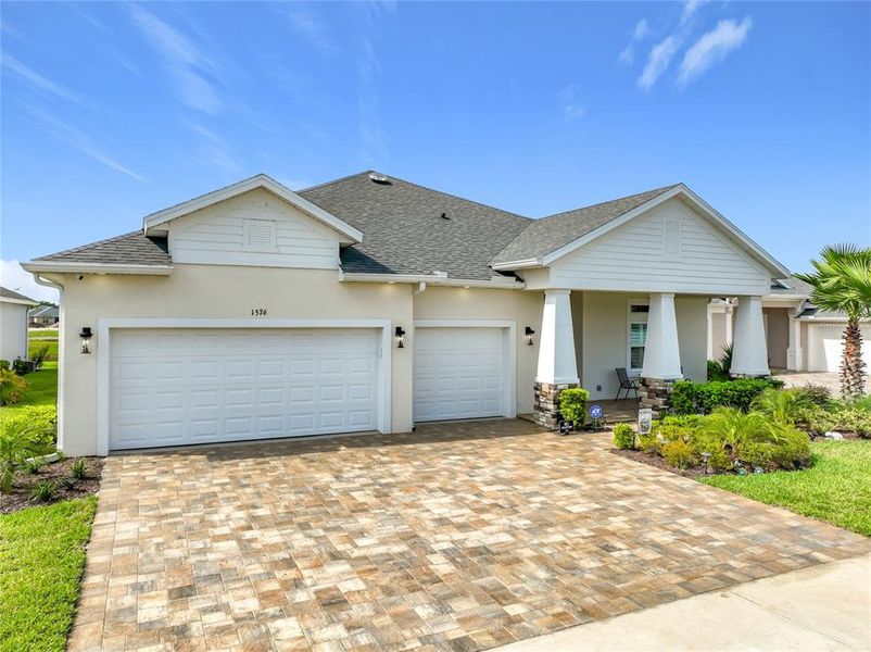 Front exterior of a new home in The Reserve at Victoria, Deland, FL, highlighting curb appeal (Image 1). Front exterior of a new home in The Reserve at Victoria, Deland, FL, highlighting curb appeal (Image 1).