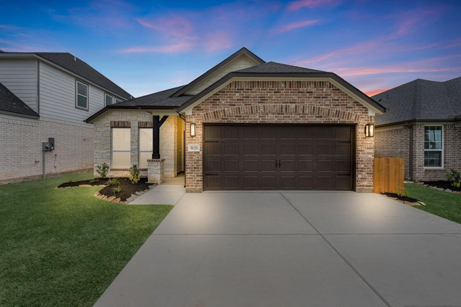 Front exterior of a new home in Grand Mason Crossing, Katy, TX, highlighting curb appeal (Image 2). Front exterior of a new home in Grand Mason Crossing, Katy, TX, highlighting curb appeal (Image 2).