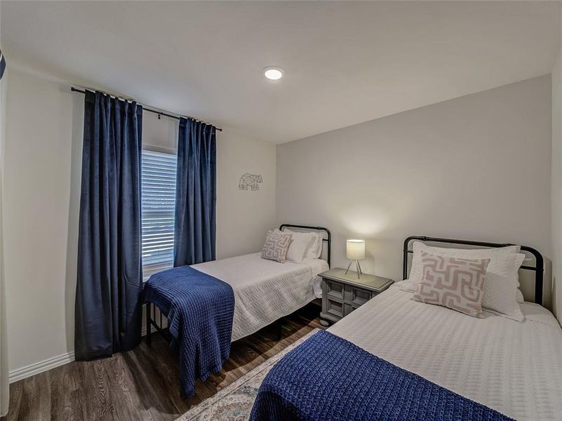 3rd Bedroom and dark wood finished floors