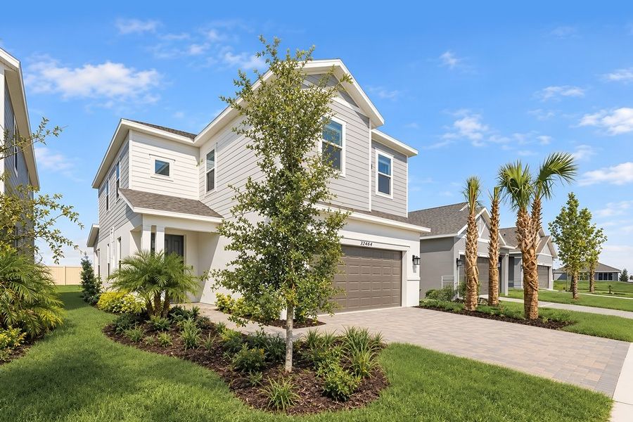 Front exterior of a new home in Lochside, Mount Dora, FL, highlighting curb appeal (Image 20).