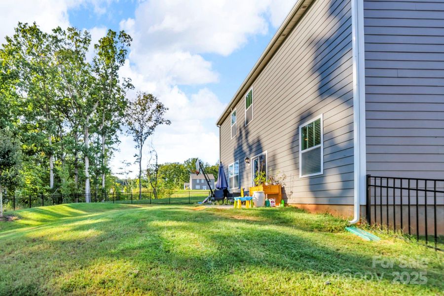 Exterior details and patio area of a home in Calvin Creek, Troutman (Image 1).